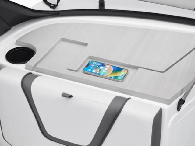 Slide: The Image of 2025 Yamaha Boats AR220 interior with smartphone holder and cup holder. - 27