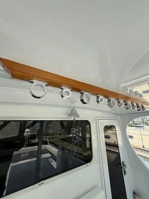 Slide: The Image of 2004 Mabry 40 boat interior with polished metal fixtures and wooden trim. - 19