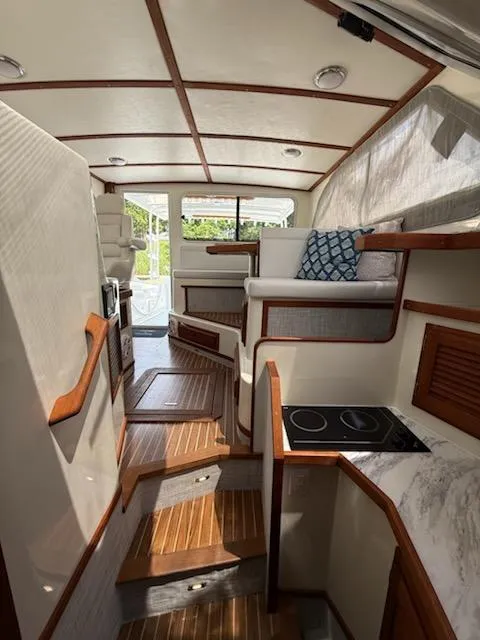 Slide: The Image of Interior of a 2004 Mabry 40 boat with wood accents and modern amenities. - 26