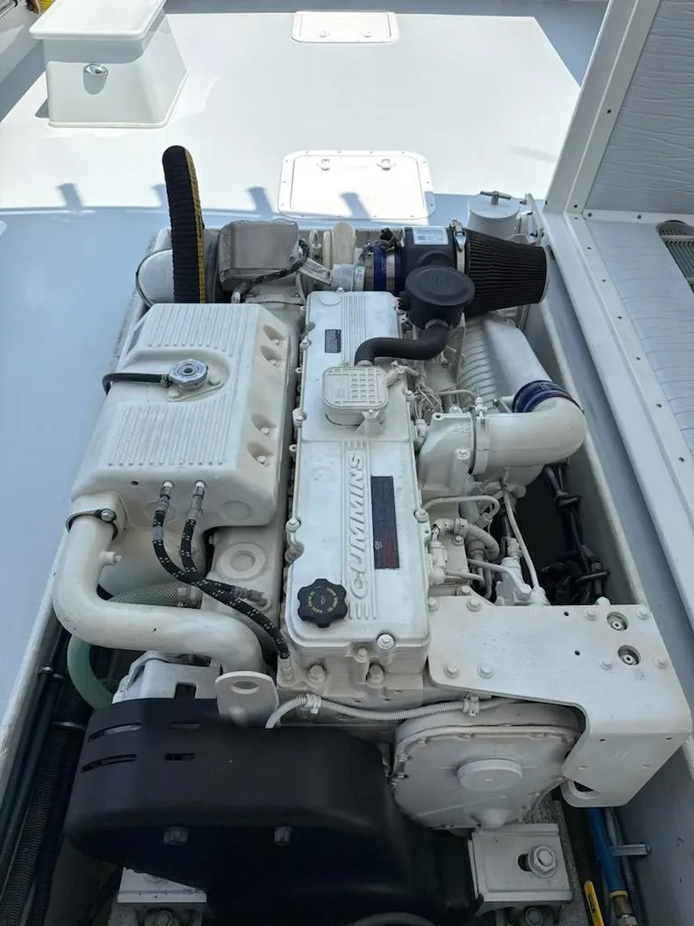 Slide: The Image of Mabry 40 engine, 2004 model, featuring a clean and well-maintained design in a marine setting. - 34