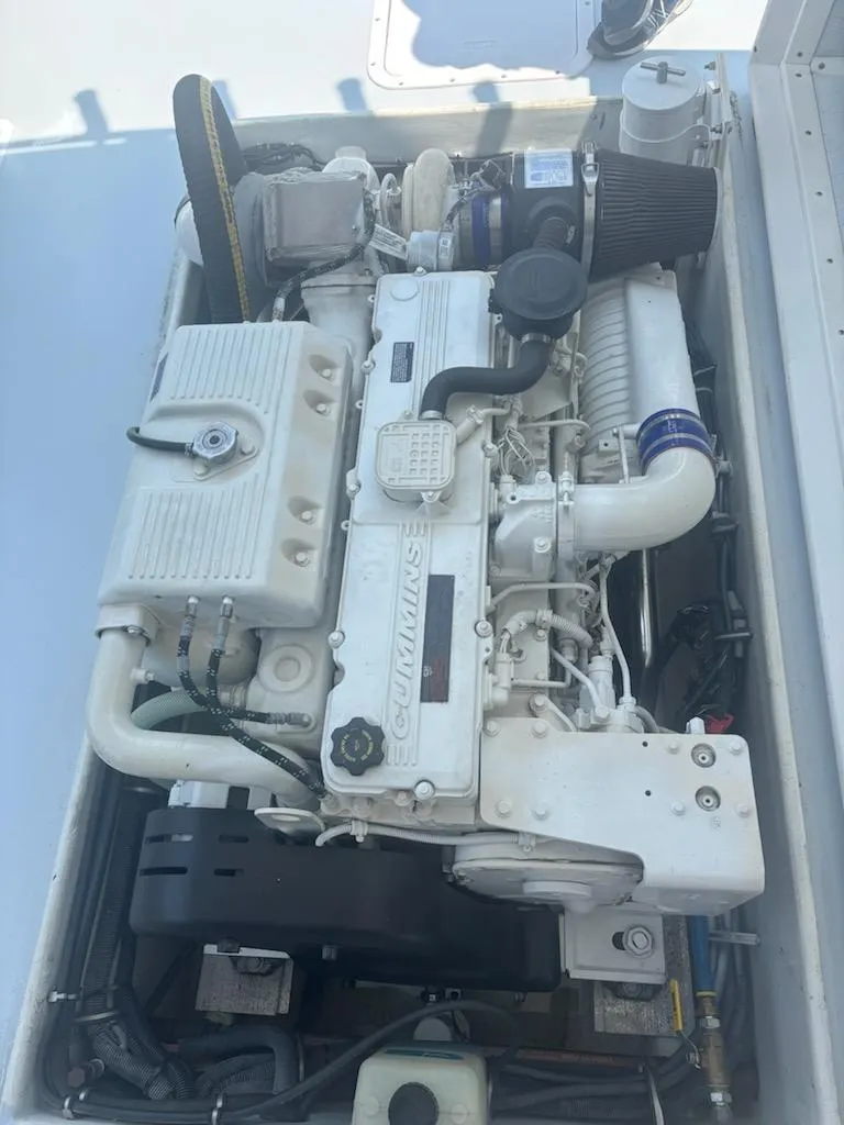 Slide: The Image of Engine of a 2004 Mabry 40 boat, featuring a Cummins diesel engine. - 35
