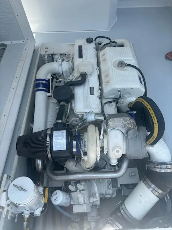 Slide: The Image of Mabry 40 engine, 2004 model, featuring complex piping and components in a clean compartment. - 36