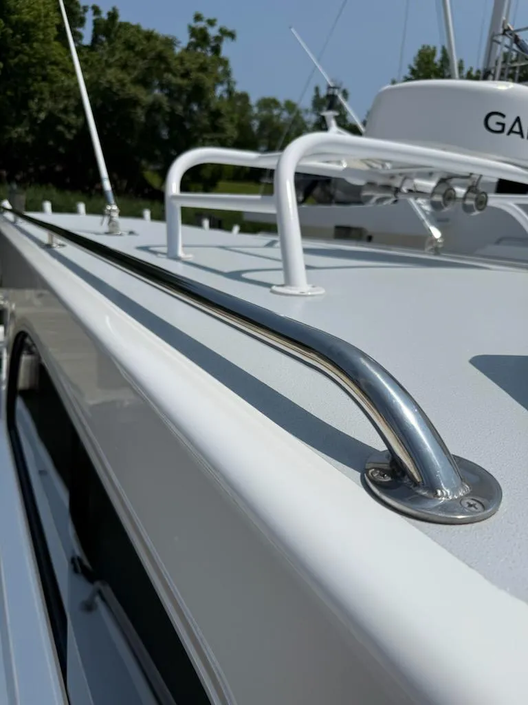 Slide: The Image of Close-up of a 2004 Mabry 40 boat's sleek railing and deck details. - 4