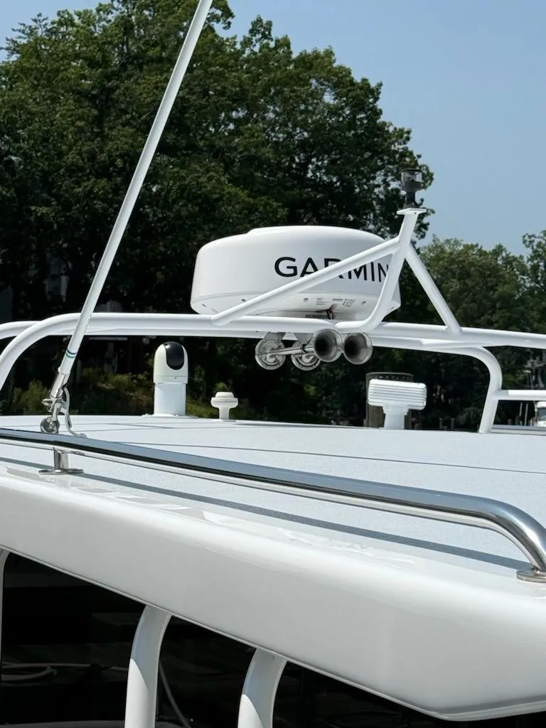 Slide: The Image of 2004 Mabry 40 boat with Garmin radar, docked near trees. - 5