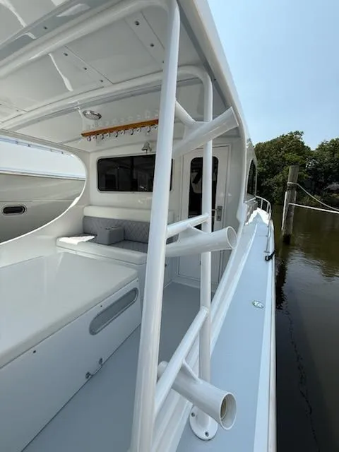 Slide: The Image of 2004 Mabry 40 boat with white interior, docked by calm water. - 7