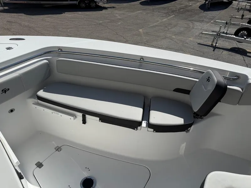 Slide: The Image of 2025 Sea Pro 242 Center Console boat interior with cushioned seating. - 10