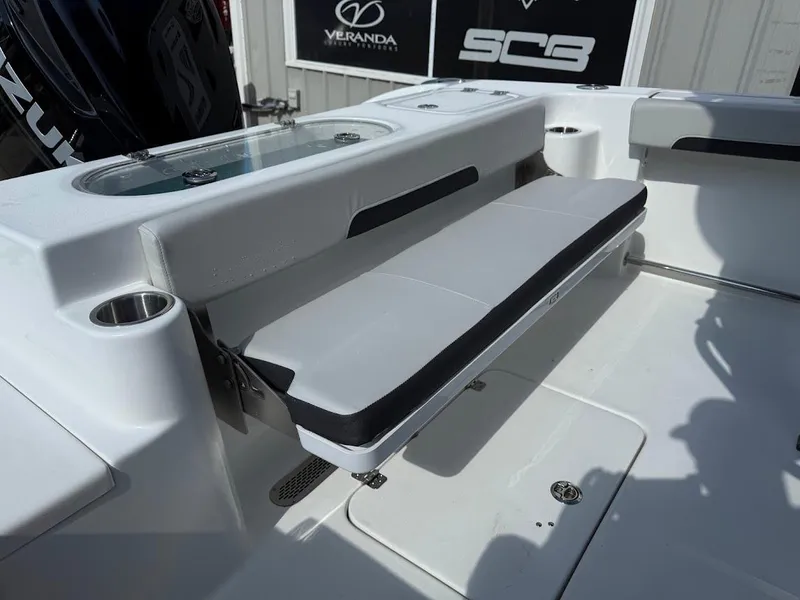 Slide: The Image of 2025 Sea Pro 242 Center Console boat interior with seating and storage features. - 14