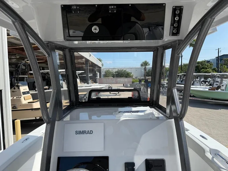 Slide: The Image of 2025 Sea Pro 242 Center Console boat interior with Simrad navigation system. - 17