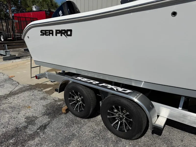 Slide: The Image of 2025 Sea Pro 242 Center Console boat on trailer, side view. - 4