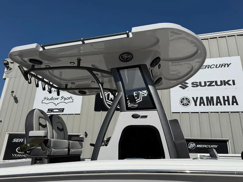 Slide: The Image of 2025 Sea Pro 242 Center Console boat with T-top, displayed outdoors. - 5