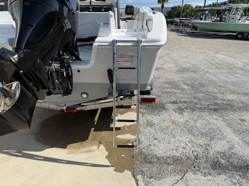 Slide: The Image of 2025 Sea Pro 242 Center Console boat with ladder and outboard motor. - 7