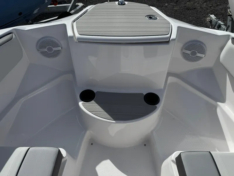 Slide: The Image of 2025 Yamaha AR220 boat interior with seating, cup holders, and speakers. - 10
