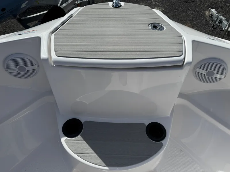 Slide: The Image of 2025 Yamaha Boats AR220 bow area with speakers and cup holders. - 11