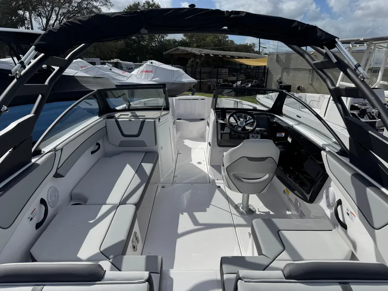 Slide: The Image of 2025 Yamaha Boats AR220 interior with sleek seating and modern dashboard design. - 3