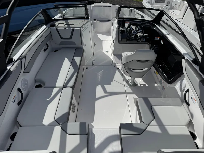 Slide: The Image of 2025 Yamaha Boats AR220 interior with sleek seating and modern dashboard design. - 4