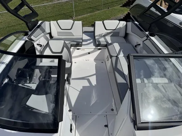 Slide: The Image of 2025 Yamaha Boats AR220 interior with spacious seating and modern design. - 15