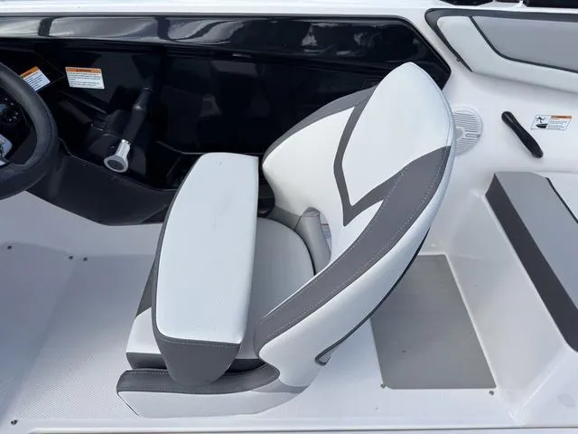Slide: The Image of Captain's seat in 2025 Yamaha AR220 boat, featuring sleek design and comfortable upholstery. - 20