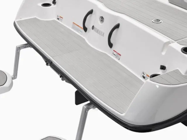 Slide: The Image of 2025 Yamaha Boats AR220 swim platform with sleek design and sturdy handles. - 28