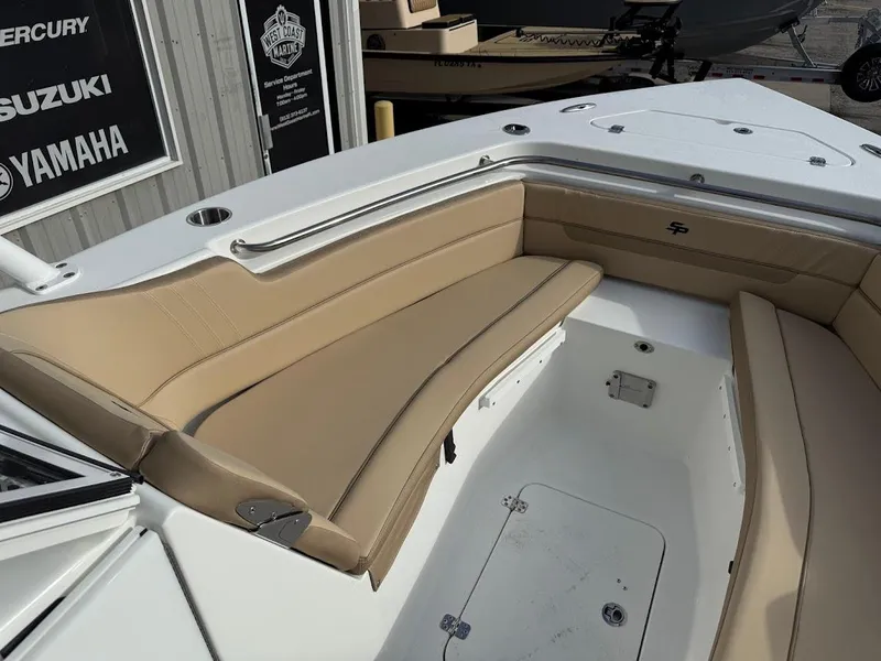 Slide: The Image of 2025 Sea Pro 240 Dual Console boat with tan seating and white deck. - 16