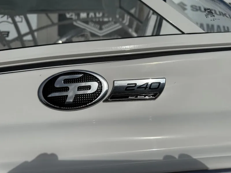 Slide: The Image of 2025 Sea Pro 240 Dual Console boat helm with Simrad display and steering wheel. - 3