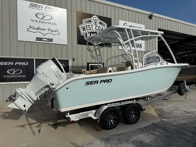 Slide: The Image of 2025 Sea Pro 240 Dual Console boat with beige seating at West Coast Marine. - 4