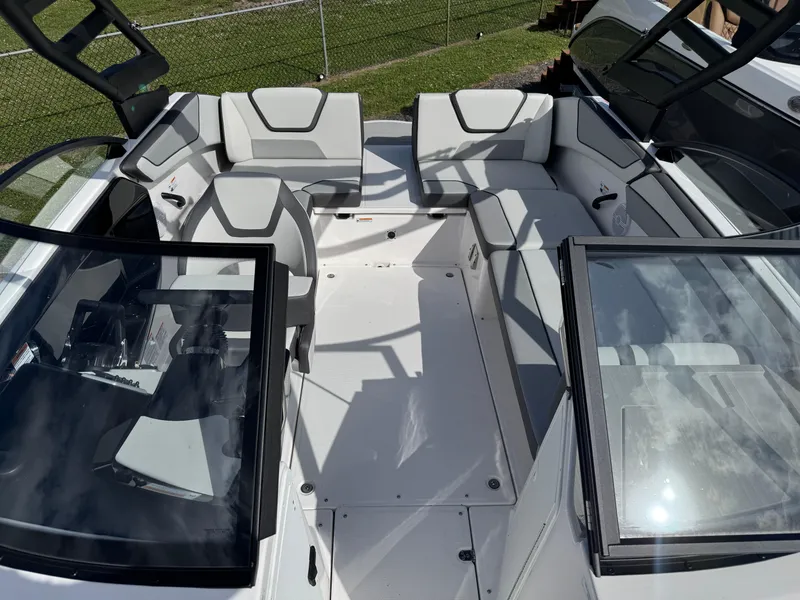 Slide: The Image of 2025 Yamaha Boats AR220 interior with sleek seating and modern design. - 14