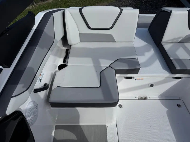 Slide: The Image of 2025 Yamaha Boats AR220 interior seating with modern design and gray accents. - 18