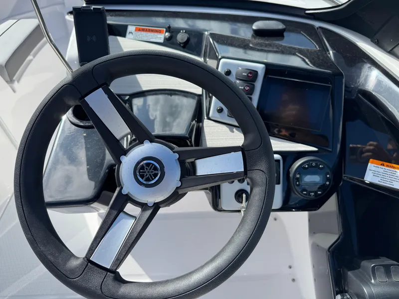 Slide: The Image of Steering wheel and dashboard of 2025 Yamaha Boats AR220. - 20