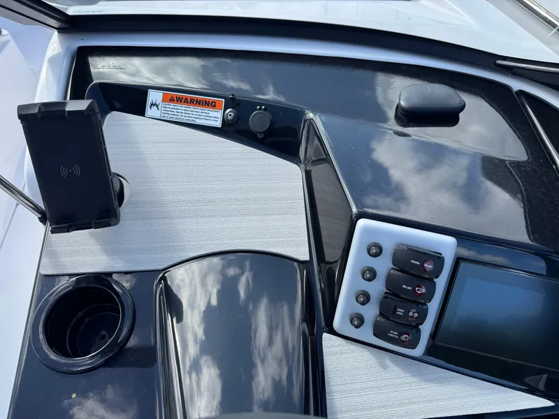 Slide: The Image of Control panel of 2025 Yamaha Boats AR220 with modern features and sleek design. - 22