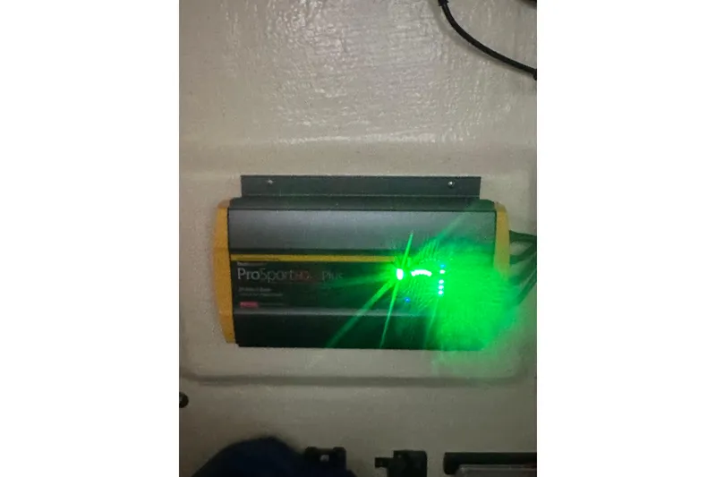 Slide: The Image of ProSportHD Plus charger with green LED lights on a 2021 Sea Cat 260 boat. - 17