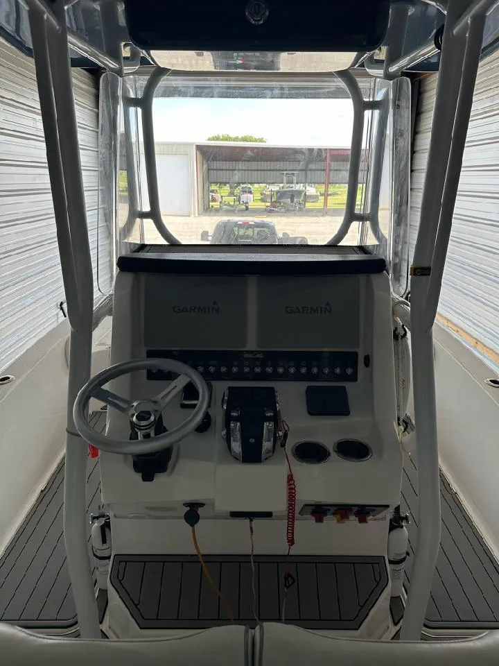 Slide: The Image of Interior view of 2021 Sea Cat 260 boat cockpit with steering wheel and control panel. - 5