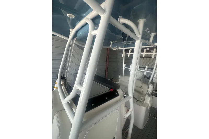 Slide: The Image of 2021 Sea Cat 260 boat interior with sturdy white framework and seating. - 8