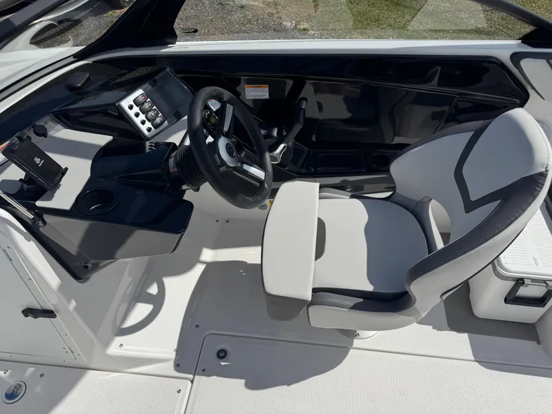 Slide: The Image of 2025 Yamaha Boats AR220 cockpit with modern steering and controls. - 18