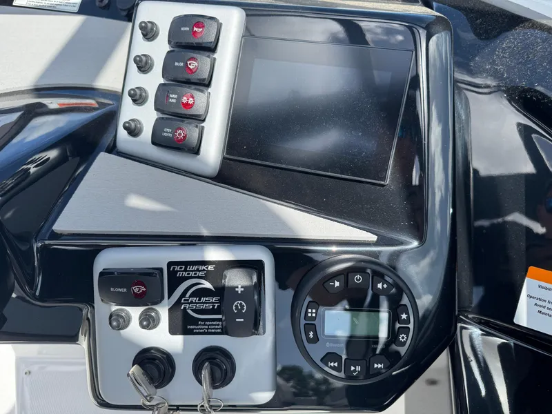 Slide: The Image of Control panel of 2025 Yamaha Boats AR220 with touchscreen and switches. - 20
