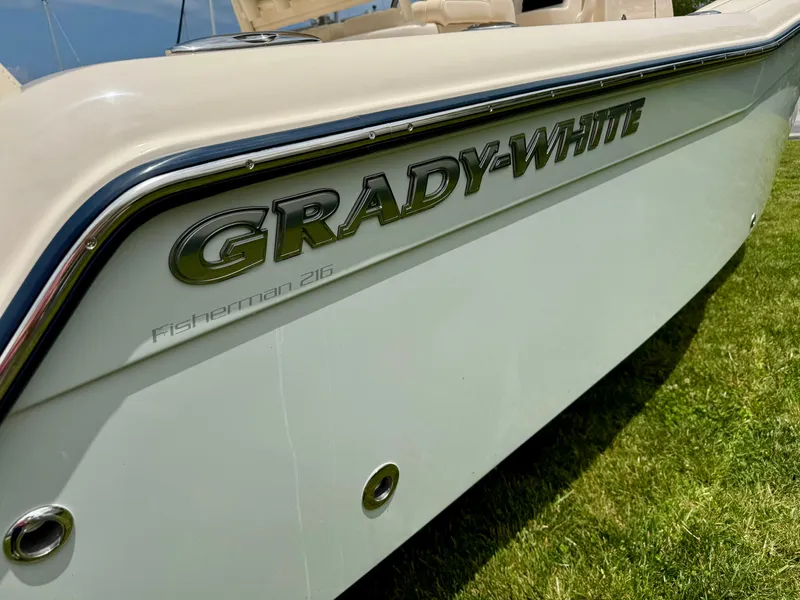 Slide: The Image of 2025 Grady-White Fisherman 216 boat side view on grass. - 4