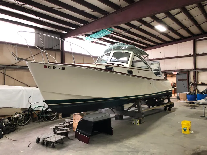 Slide: The Image of 2008 Landing School Arundel 27 boat in indoor storage facility. - 24