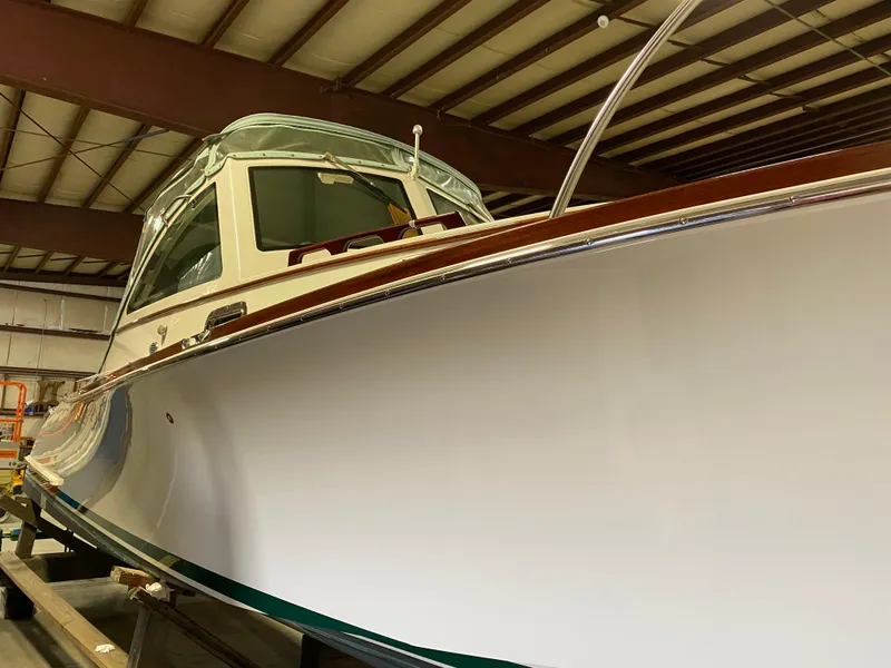 Slide: The Image of 2008 Landing School Arundel 27 boat in storage, showcasing sleek design and craftsmanship. - 26