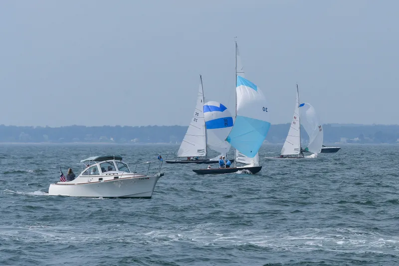 Slide: The Image of 2008 Landing School Arundel 27 motorboat and sailboats on open water. - 3
