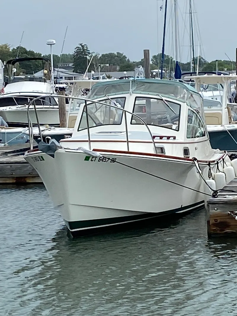 Slide: The Image of 2008 Landing School Arundel 27 boat docked in a marina. - 6
