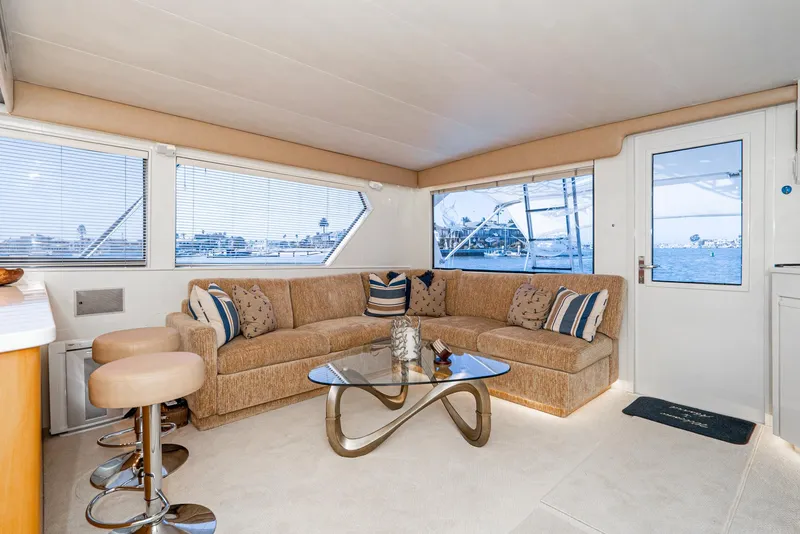 Slide: The Image of Luxurious interior of 1990 Hatteras 58 Sportfish yacht with plush seating and modern decor. - 28