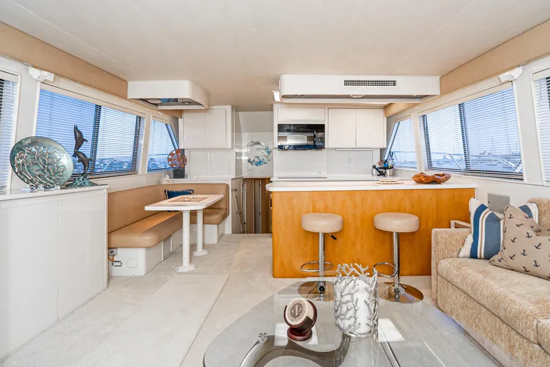 Slide: The Image of Interior of 1990 Hatteras 58 Sportfish yacht with modern kitchen and seating area. - 29