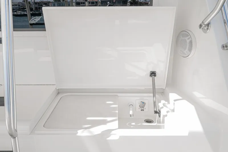 Slide: The Image of Hatteras 58 Sportfish 1990 yacht sink area with open lid and faucet. - 33