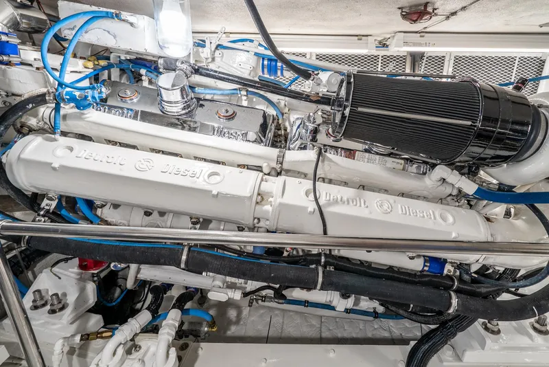 Slide: The Image of Engine room of 1990 Hatteras 58 Sportfish, showcasing detailed mechanical components. - 40
