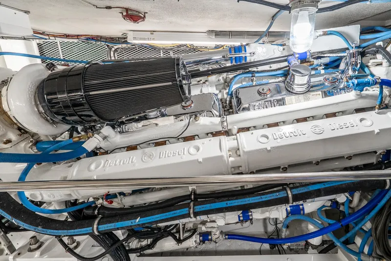 Slide: The Image of Engine room of a 1990 Hatteras 58 Sportfish, featuring a Detroit Diesel engine. - 41