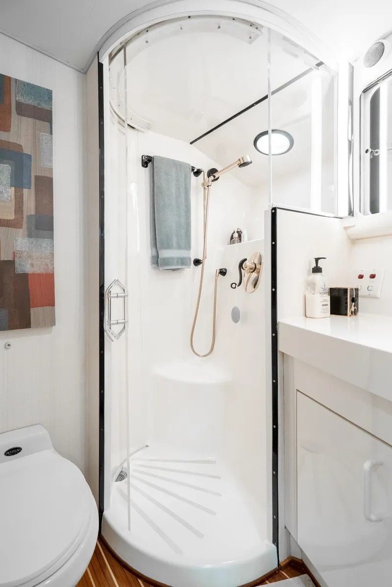 Slide: The Image of Compact bathroom with modern shower in 1990 Hatteras 58 Sportfish yacht. - 47
