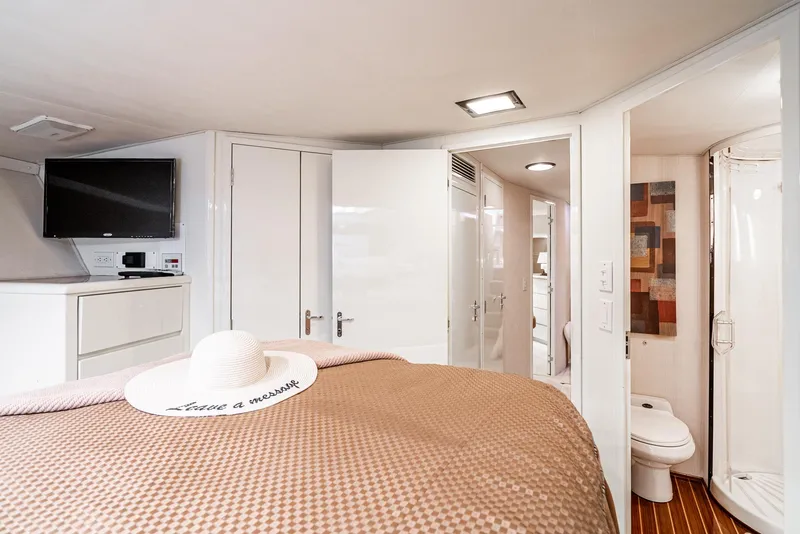 Slide: The Image of Luxurious cabin interior of 1990 Hatteras 58 Sportfish yacht with modern amenities. - 48