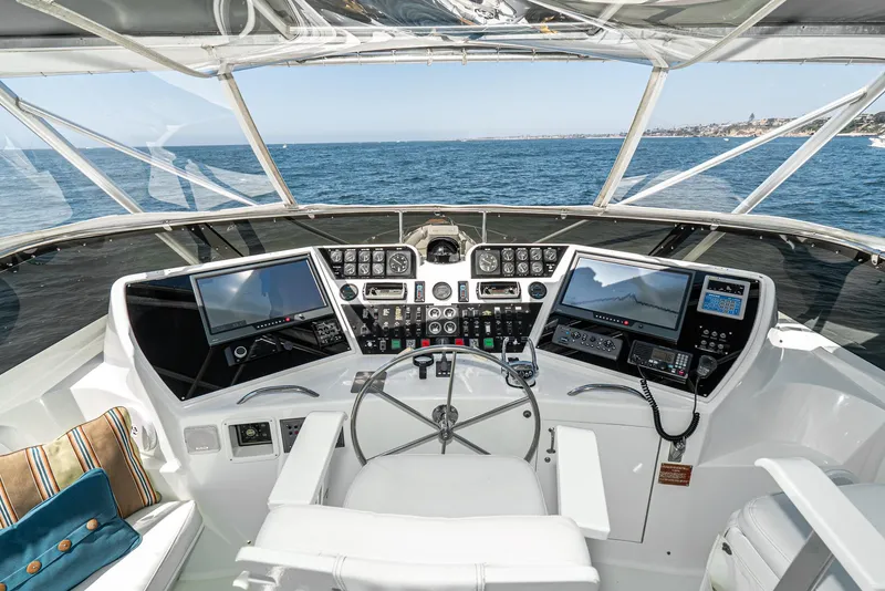 Slide: The Image of Cockpit of 1990 Hatteras 58 Sportfish yacht with advanced navigation systems. - 7