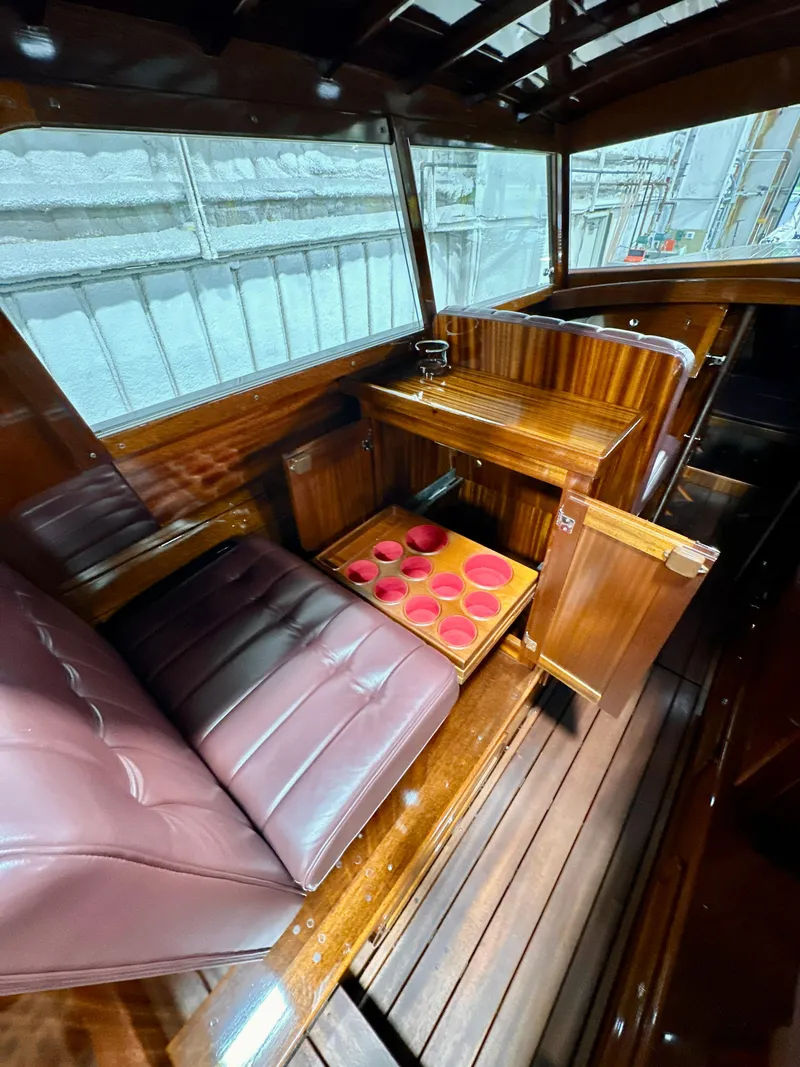 Slide: The Image of Luxurious 2015 Van Dam 35 boat interior with wooden finish and leather seating. - 10
