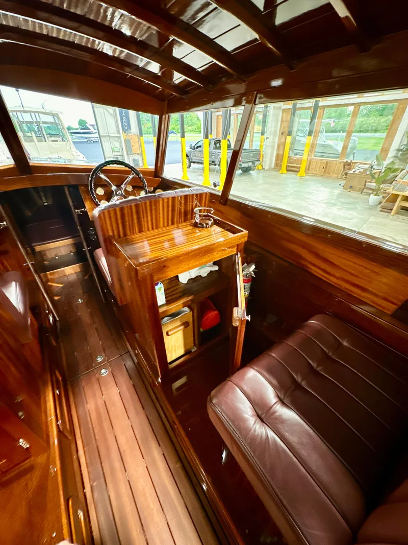 Slide: The Image of Luxurious 2015 Van Dam 35 boat interior with polished wood and leather seating. - 11
