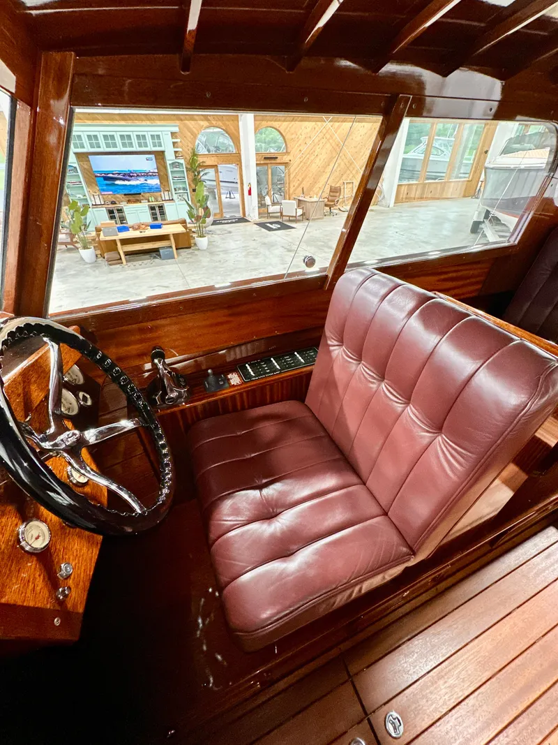 Slide: The Image of Luxurious Van Dam 35 boat interior with leather seating and wooden accents, 2015 model. - 14